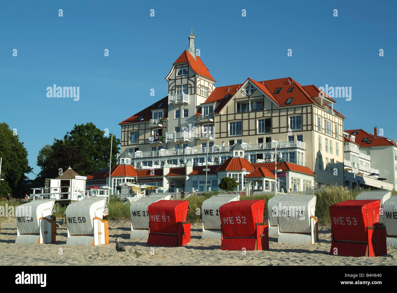 Wicker beach chairs on beach Stock Photo