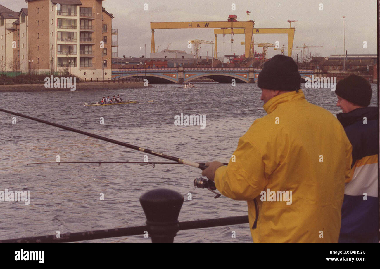 Head Of The River Race On The River Lagan Belfast February 1999 Anglers Trevor Smith and Paul Crozier fishing for Sea Trout while the Laganside Head of the River race goes past A total of 88 teams from both Northern Ireland and the Republic took part on the river Lagan in Belfast Mirrorpix Stock Photo