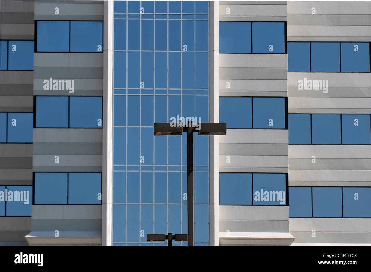 Abstract of a modern mirrored office building Stock Photo - Alamy