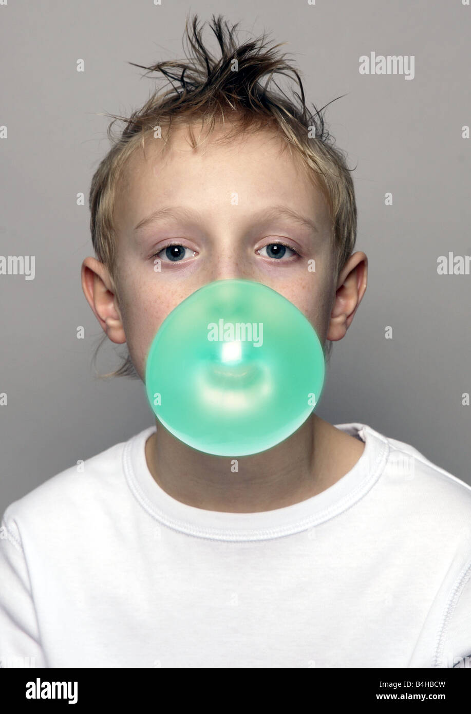 Portrait of boy blowing chewing gum Stock Photo Alamy