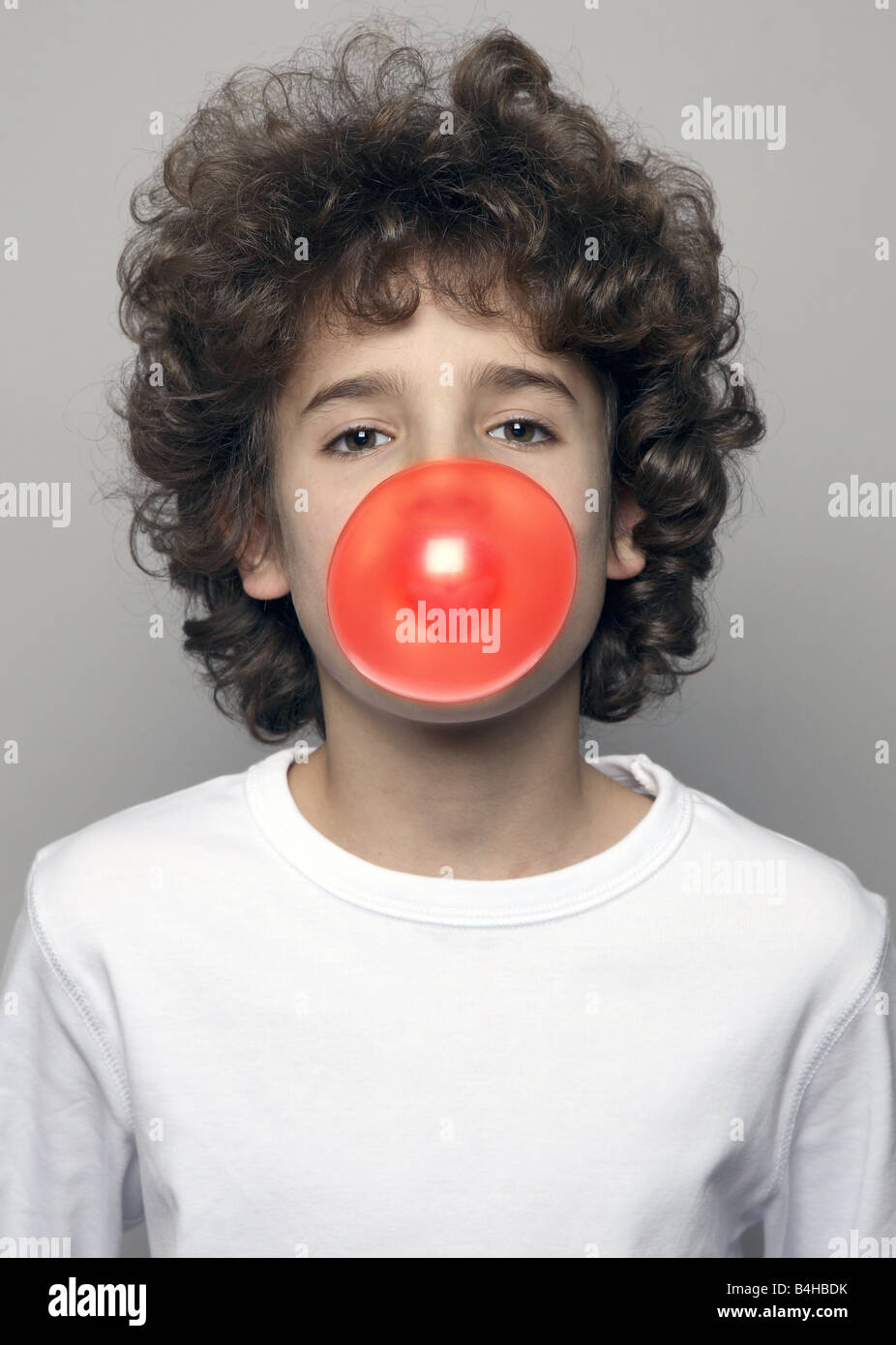 Portrait of boy blowing chewing gum Stock Photo Alamy
