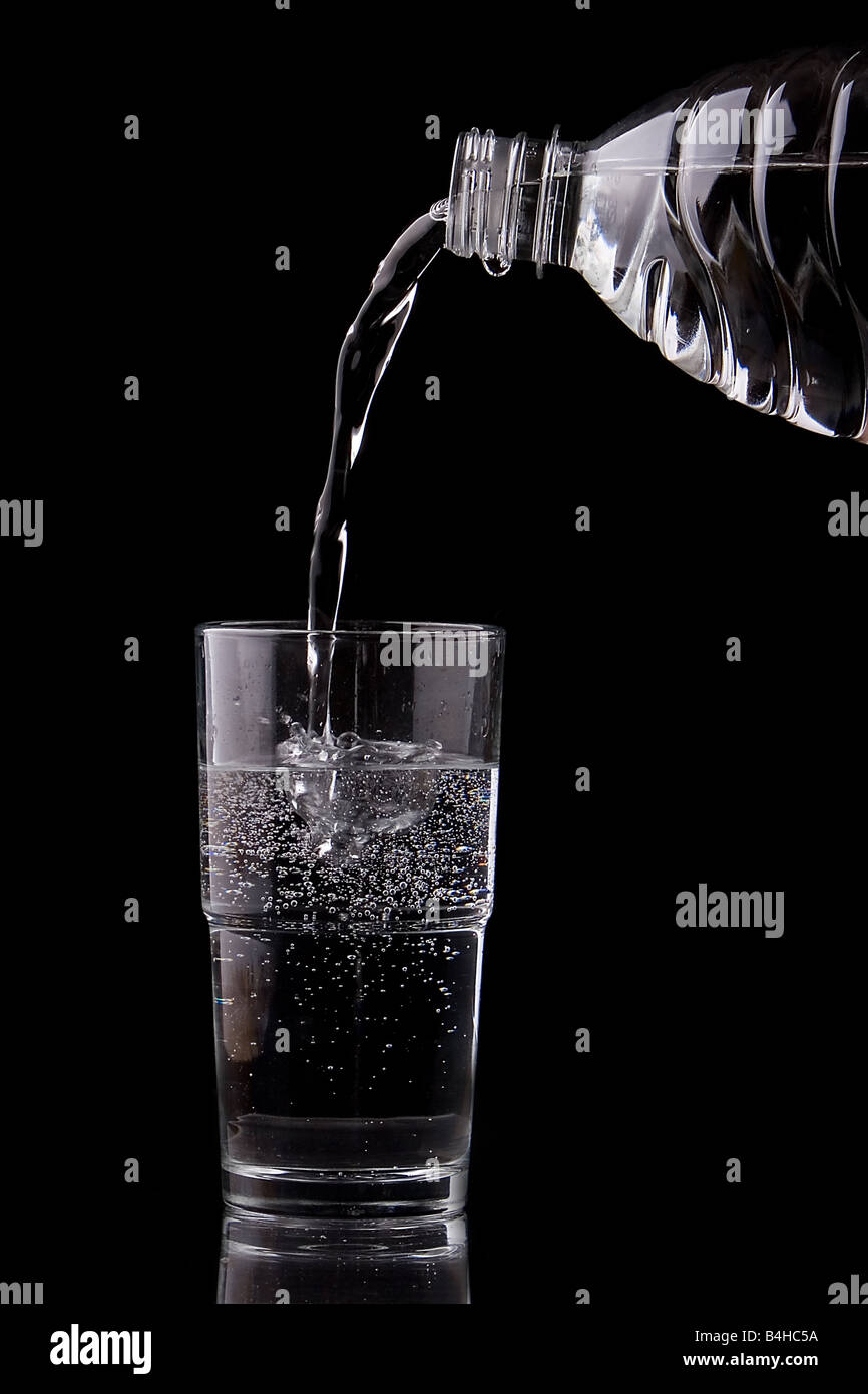 Close-up of water being poured into glass from water Stock Photo