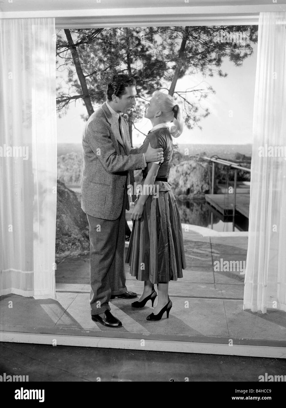 Ginger Rogers with husband Jacques Bergerac in a scene from the the