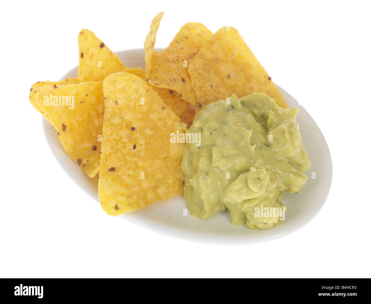 Fresh Guacamole Dip With Tortillas Chips Isolated Against A White