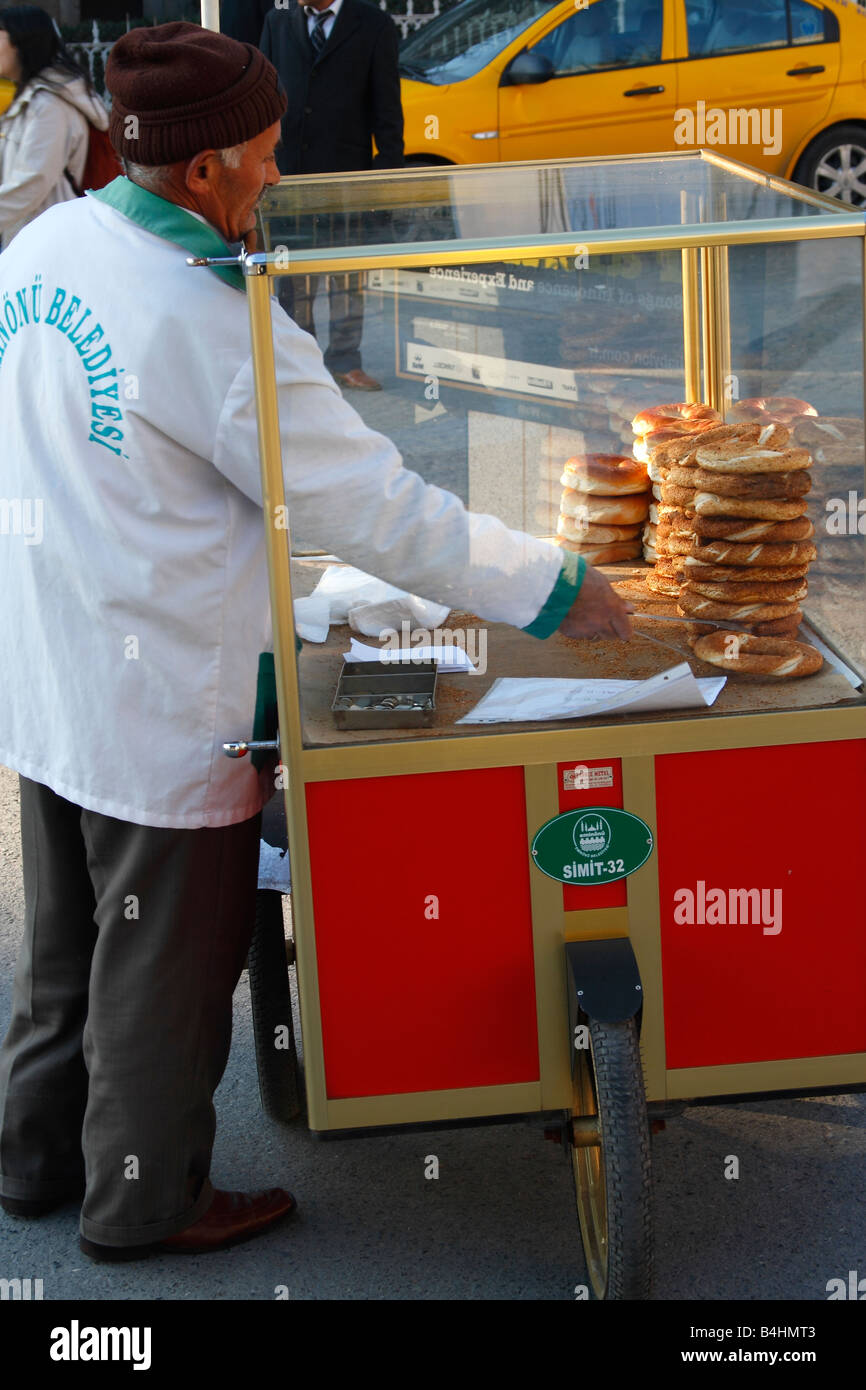 Old man and hand barrow (cart) selling “Simit” (Savory roll 