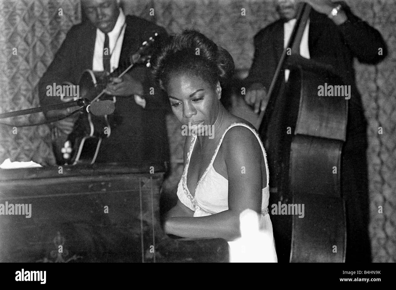 Nina Simone June 1965 Jazz singer Pictured preforming at Annies Club on stage playing piano Eunice Kathleen Waymon Nina Simone singer and songwriter born Tryon North Carolina 21 February 1933 married 1958 Don Ross marriage dissolved 1961 Andrew Stroud one daughter marriage dissolved 1971 died Carry le Rouet France 21 April 2003 She adopted the name Nina Simone Nina meaning little one came from a Hispanic boyfriend and Simone was from the French actress Simone Signoret Jazz Singers 1960s Mirrorpix Stock Photo