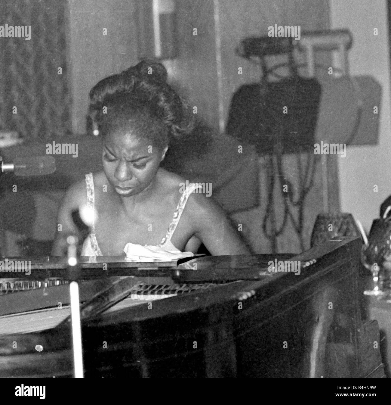 Nina Simone June 1965 Jazz singer Pictured preforming at Annies Club on stage playing piano Eunice Kathleen Waymon Nina Simone singer and songwriter born Tryon North Carolina 21 February 1933 married 1958 Don Ross marriage dissolved 1961 Andrew Stroud one daughter marriage dissolved 1971 died Carry le Rouet France 21 April 2003 She adopted the name Nina Simone Nina meaning little one came from a Hispanic boyfriend and Simone was from the French actress Simone Signoret Jazz Singers 1960s Mirrorpix Stock Photo