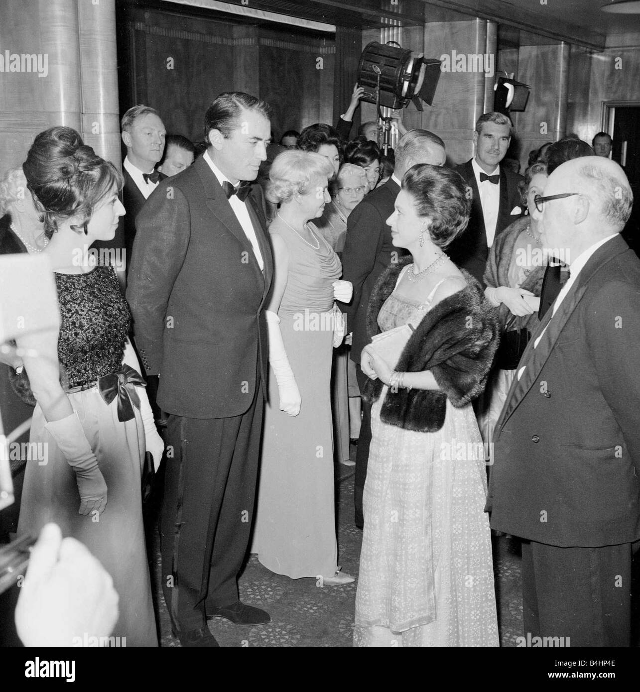 Gregory Peck with Princess Margaret at a film premiere May 1963 1960s Mirrorpix Stock Photo