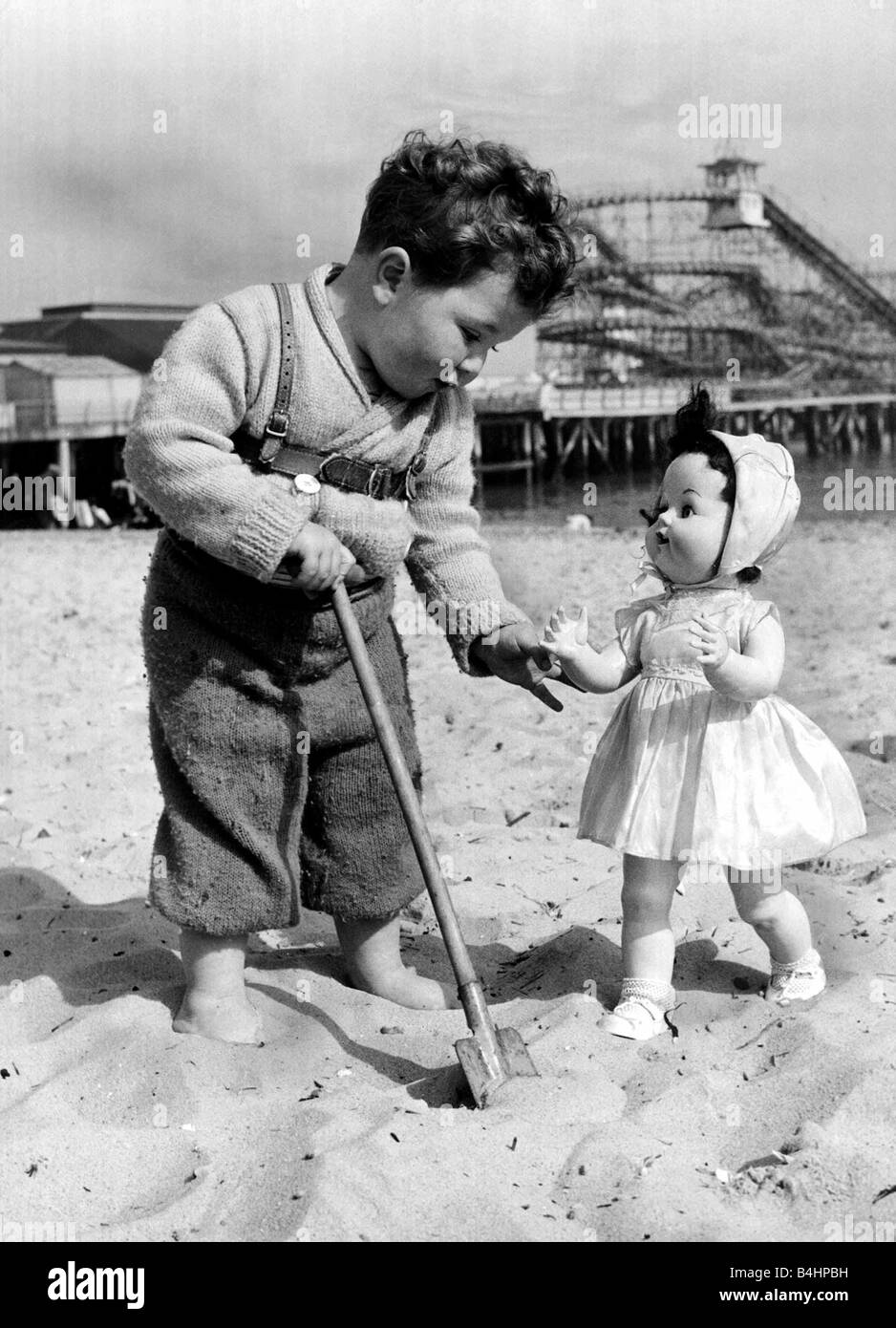 In Spring a young man s fancy likely turns to anyway this is a new version of boy meets girl Young Russell Bell aged 2 was never more surprised than when walking along the sands of Clacton Essex he saw Mabel the doll waiting Of course Mabel had strayed away from her real owner or had probably been left but Russell was fascinated never the less Stock Photo