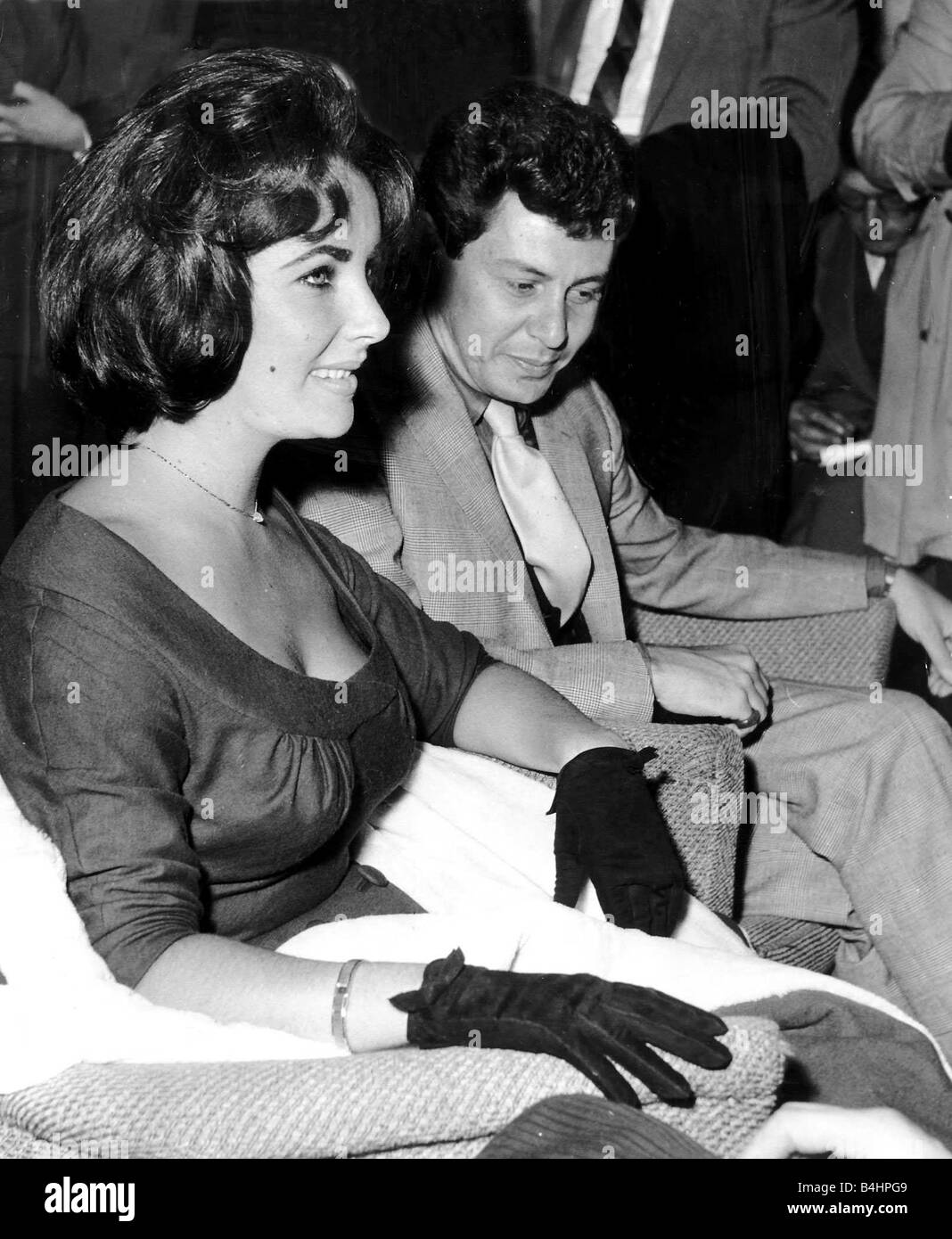 Eddie Fisher With Wife Elizabeth Taylor Actress At London Airport Where They Are Being Interviewed By The Worlds Media DBase Stock Photo