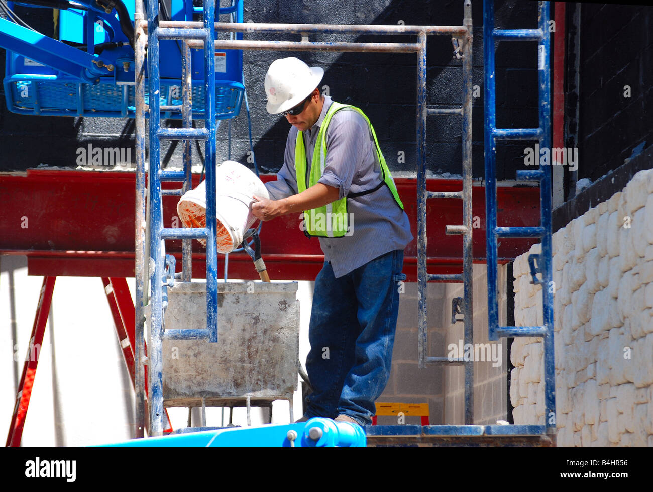 a worker pouring cement Stock Photo