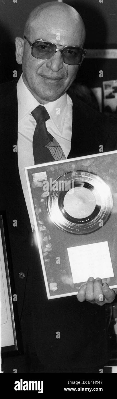 Telly Savalas actor singer with silver disc 1975 Stock Photo