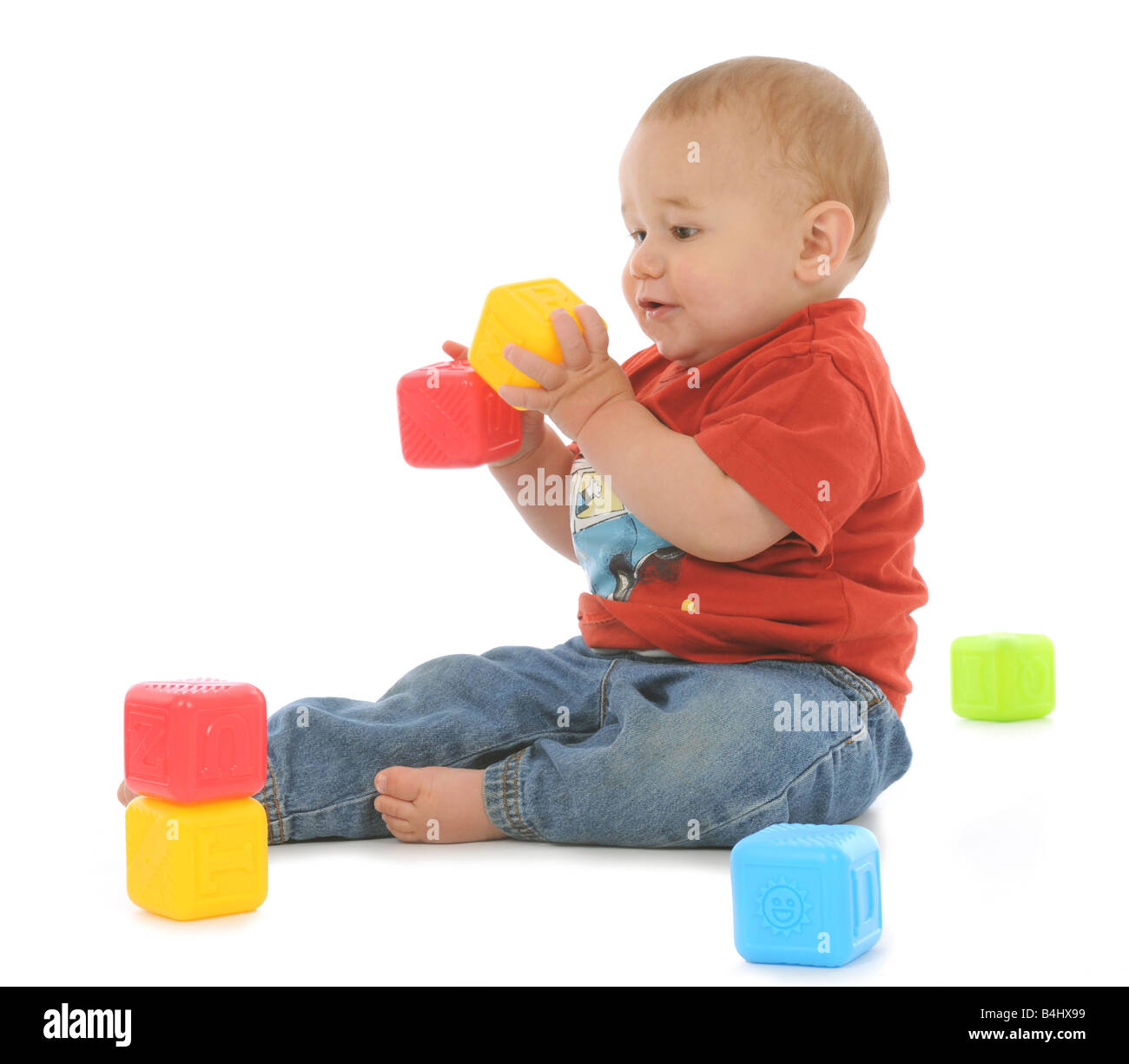 A young baby learning to walk and crawl, babies development in the ...