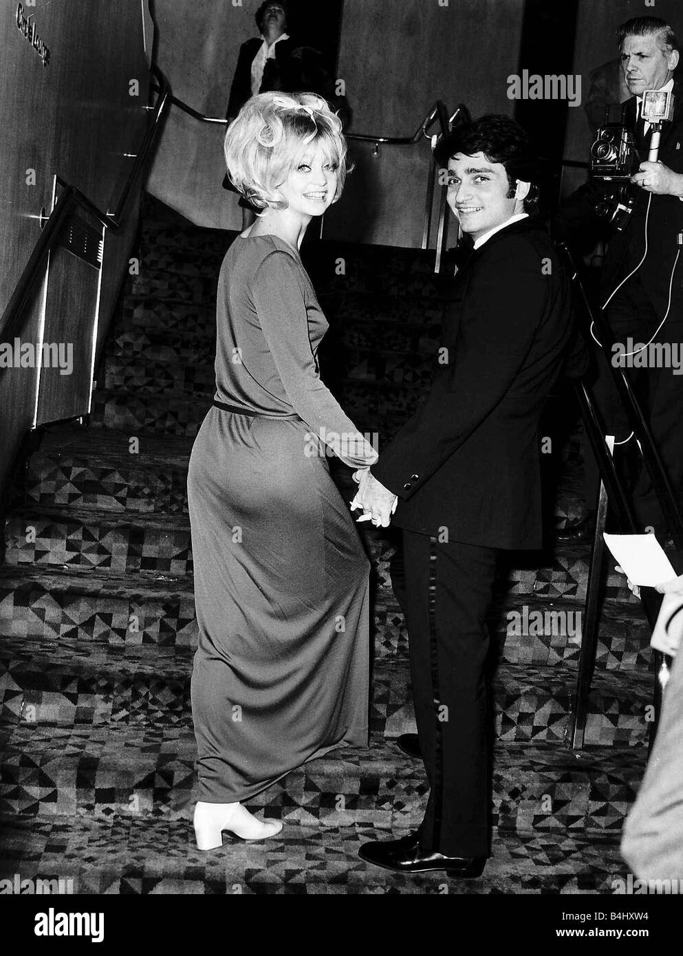 Goldie Hawn Actress holding hands with her husband Gus Trikonis at a