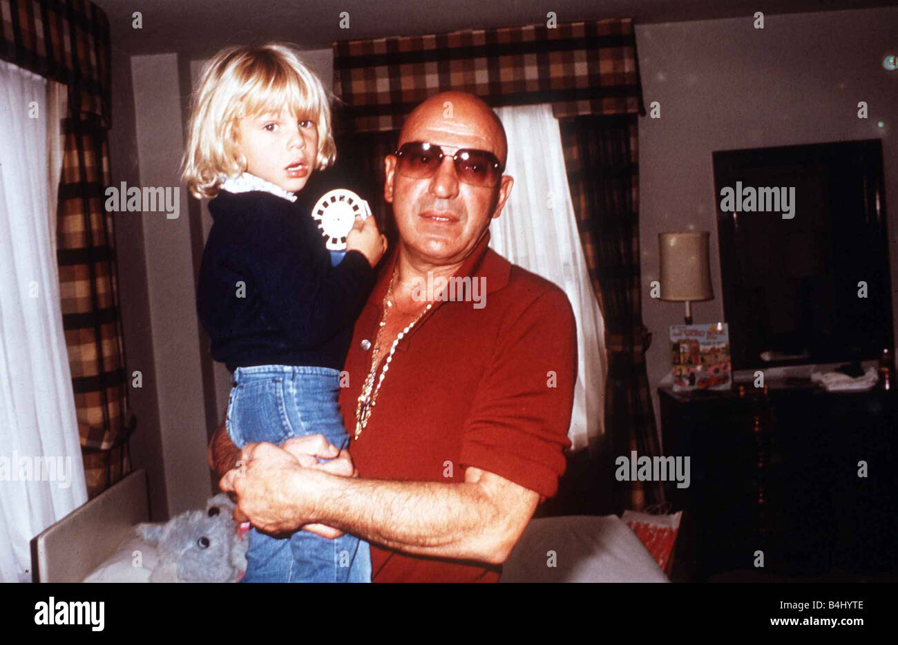 Telly Savalas the actor from Kojak with his son Nicholas February 1977 Dbase msi Stock Photo