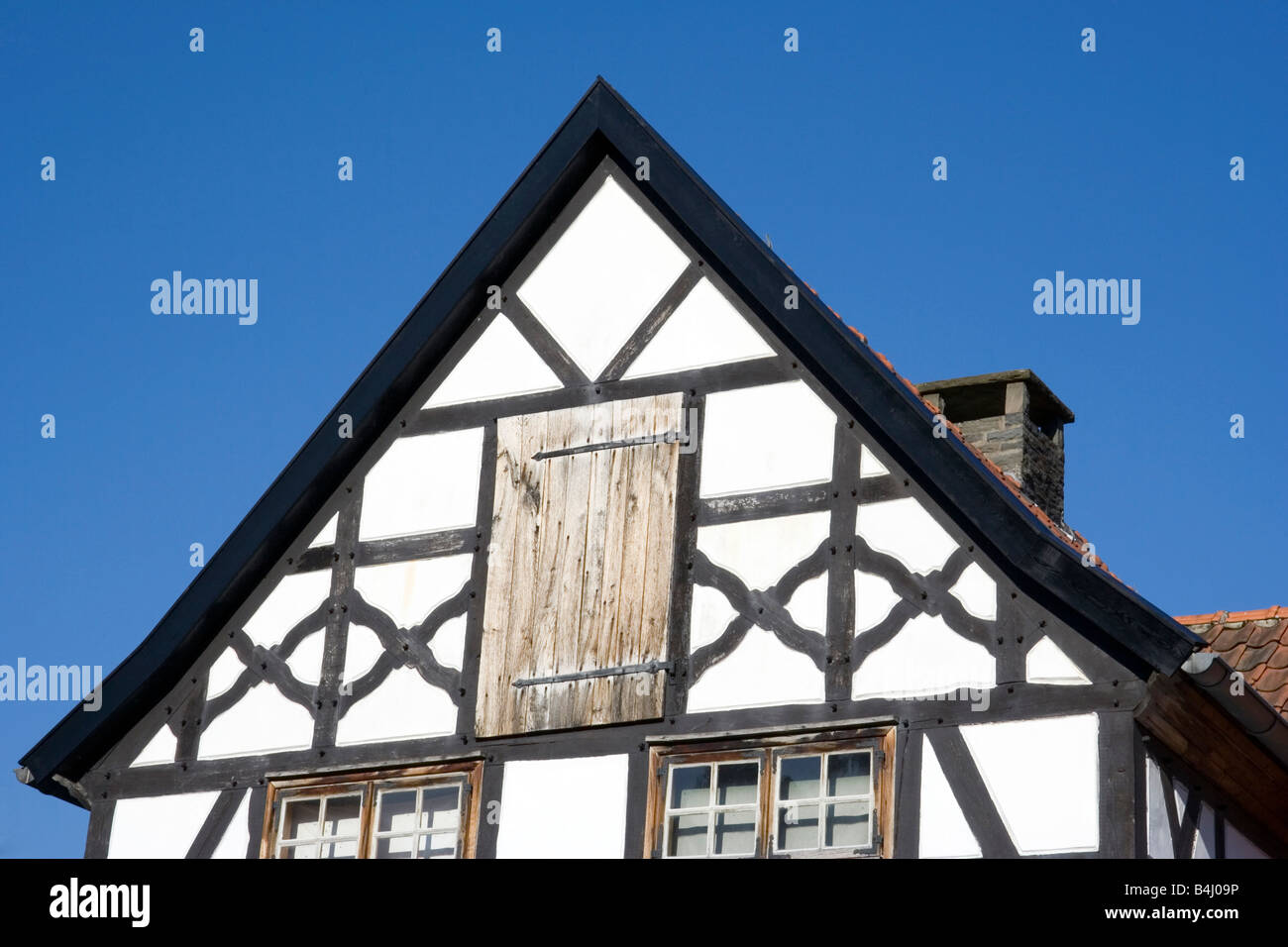 gable of a half timbered house in black and white in a traditional german village Stock Photo