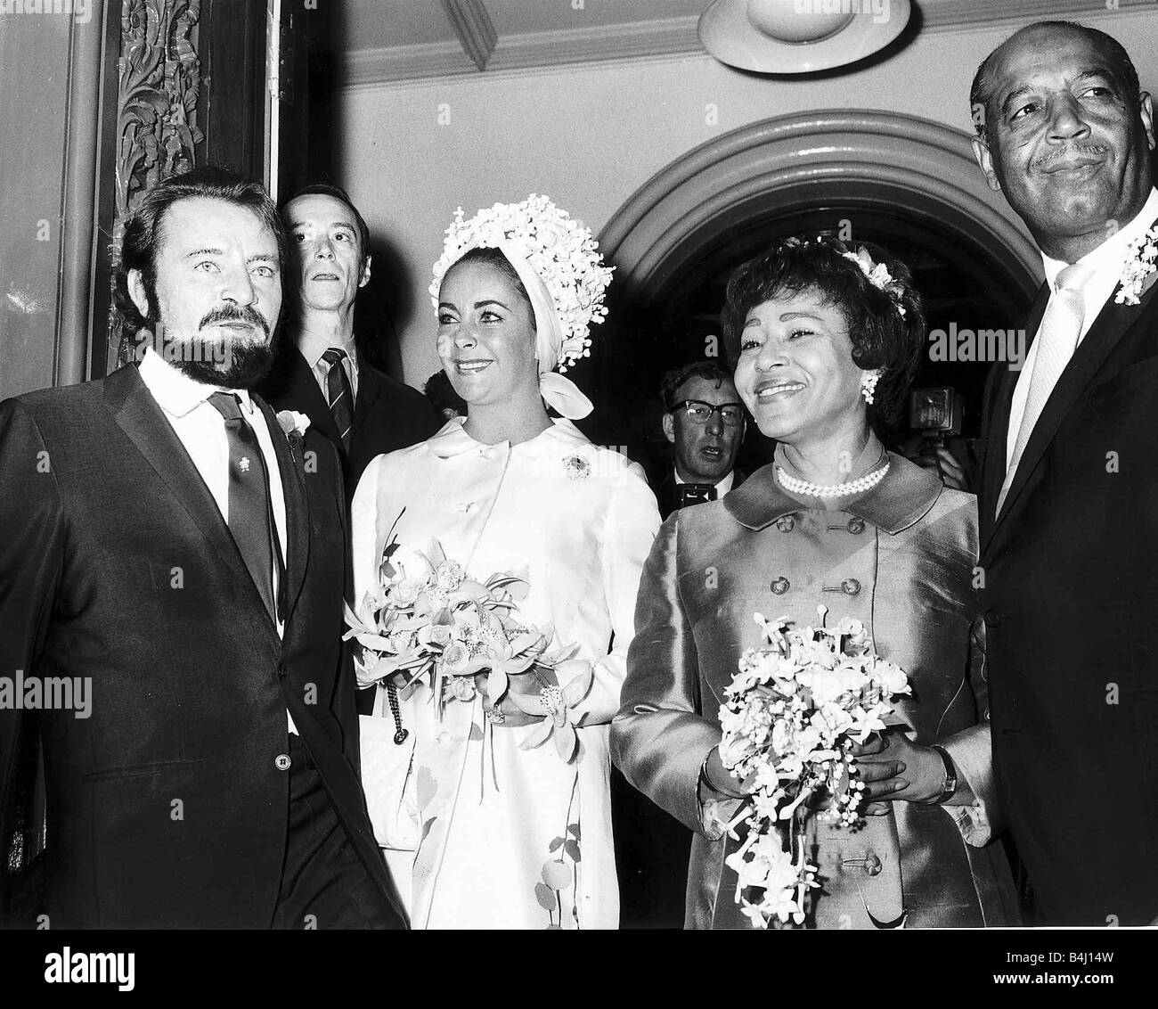 Richard Burton actor with wife Elizabeth Taylor at the wedding of his  personal assistant Robert Wilson to Gladys Mills at Caxton Hall London  Stock Photo - Alamy