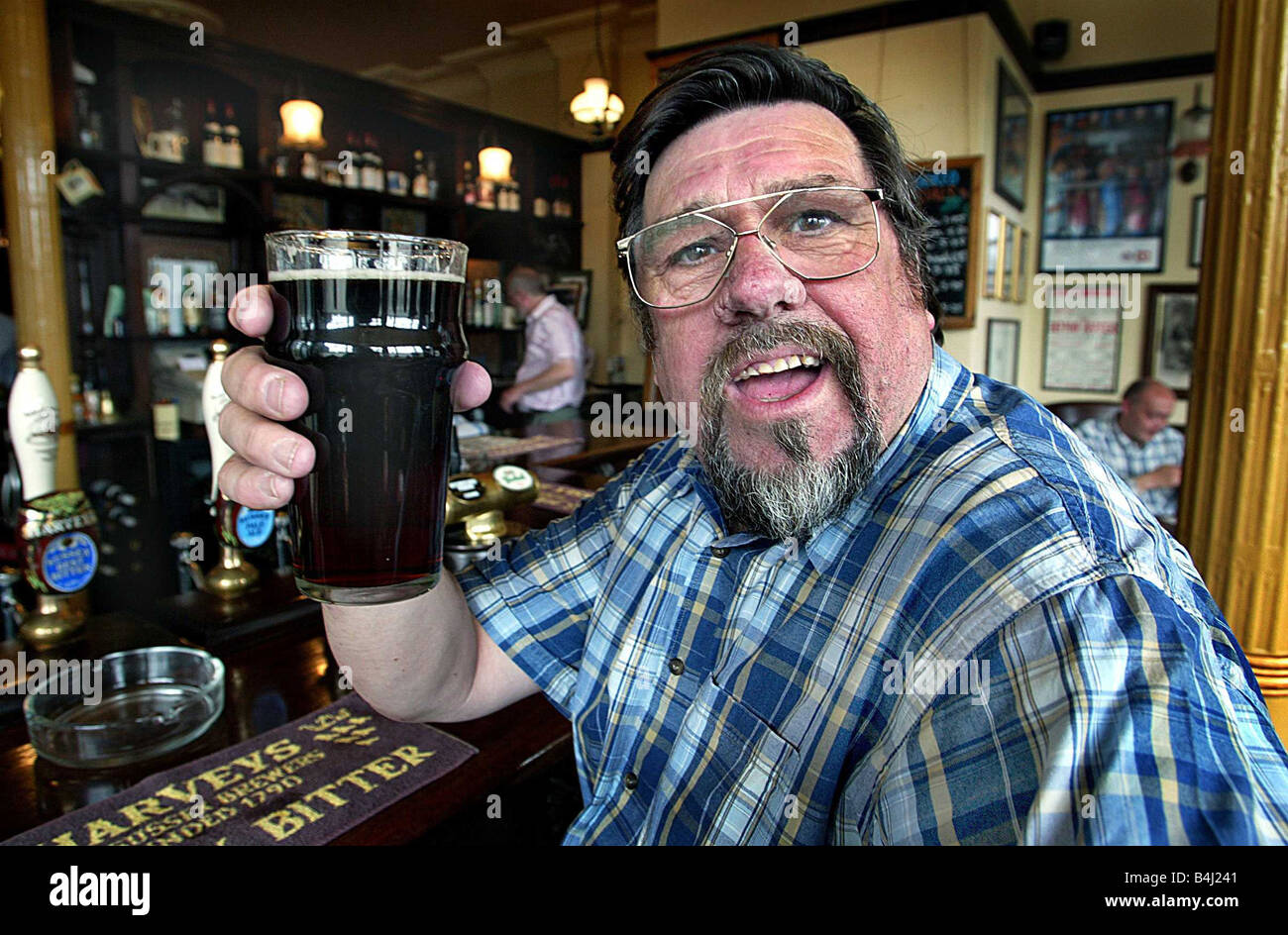 Actor Ricky Tomlinson in the pub with his favorite pint of Mild drinking  alcohol bar local Stock Photo - Alamy