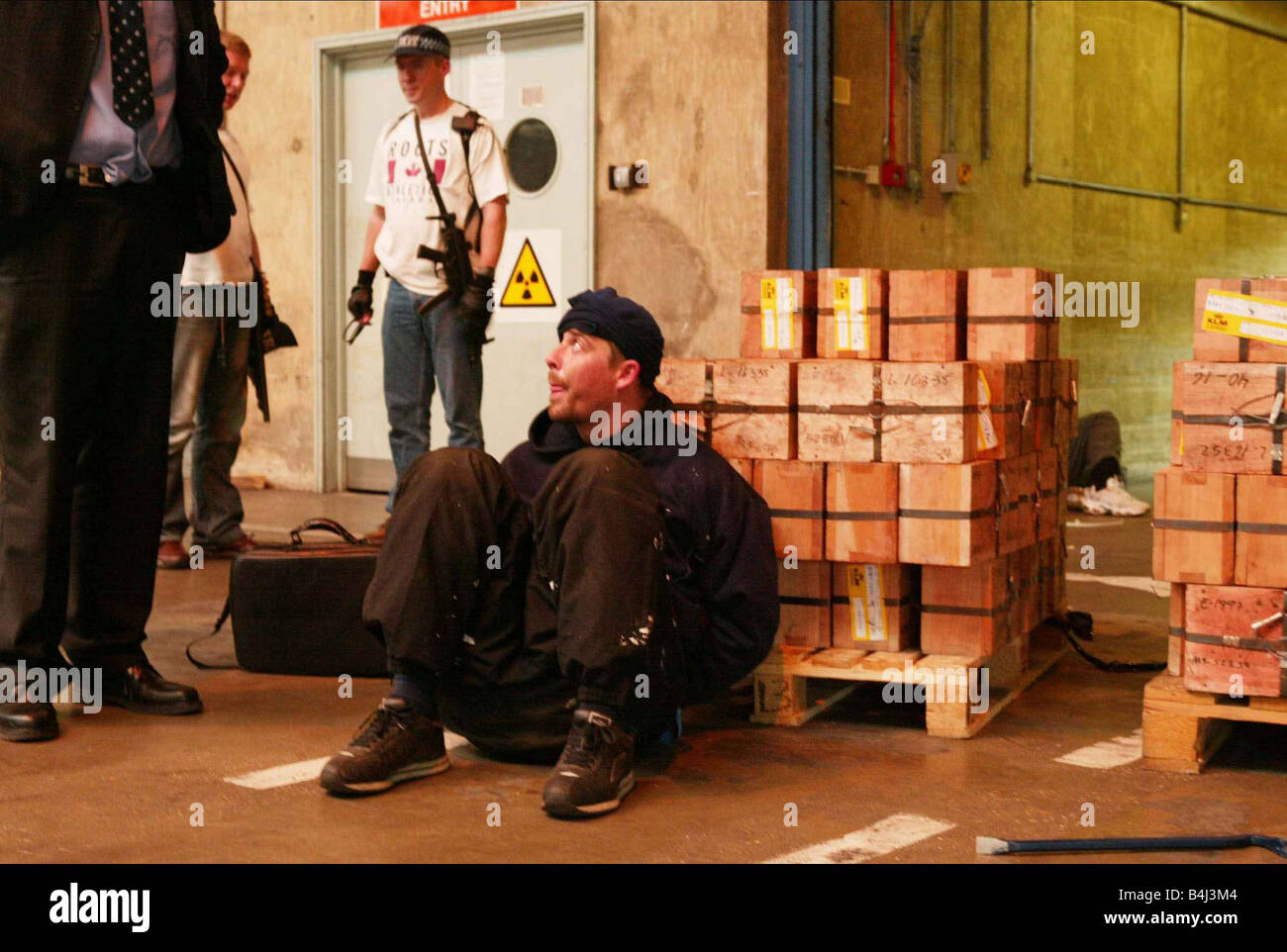 Armed policemen and robbery suspects at the scene of an attempted 30