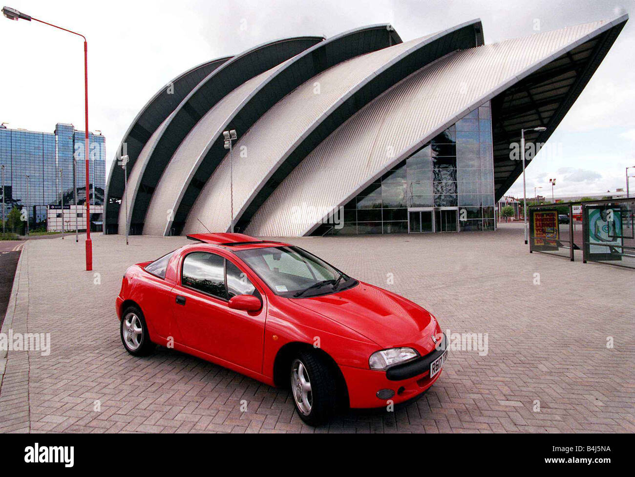 Red Vauxhall Tigra car May 1998 outside CLyde Concert Hall Aramadillo Stock Photo