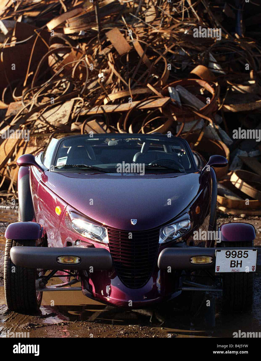 Plymouth Prowler October 1998 Convertible roadster maroon paintwork Scrapyard Stock Photo