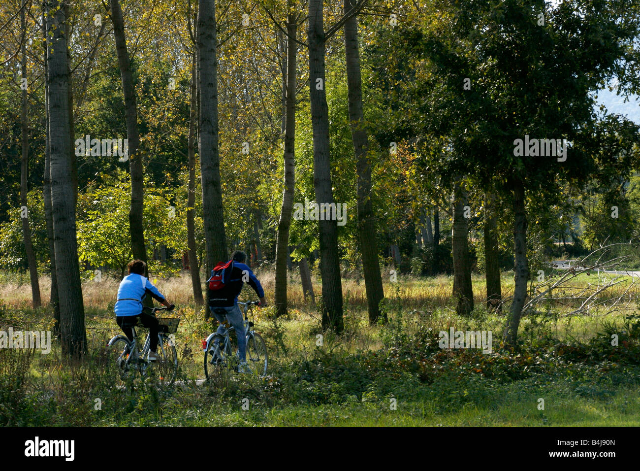 Couple riding bikes in the countryside. Stock Photo