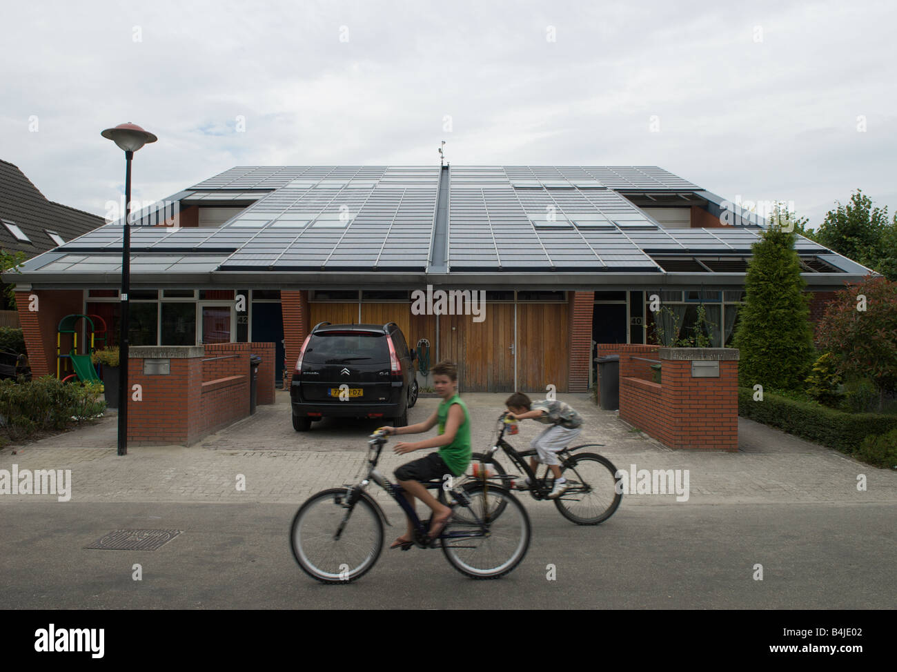 Solar panels fitted to a house on the world's largest solar powered housing estate, Nieuwland, Amersfoort, Netherlands. Stock Photo
