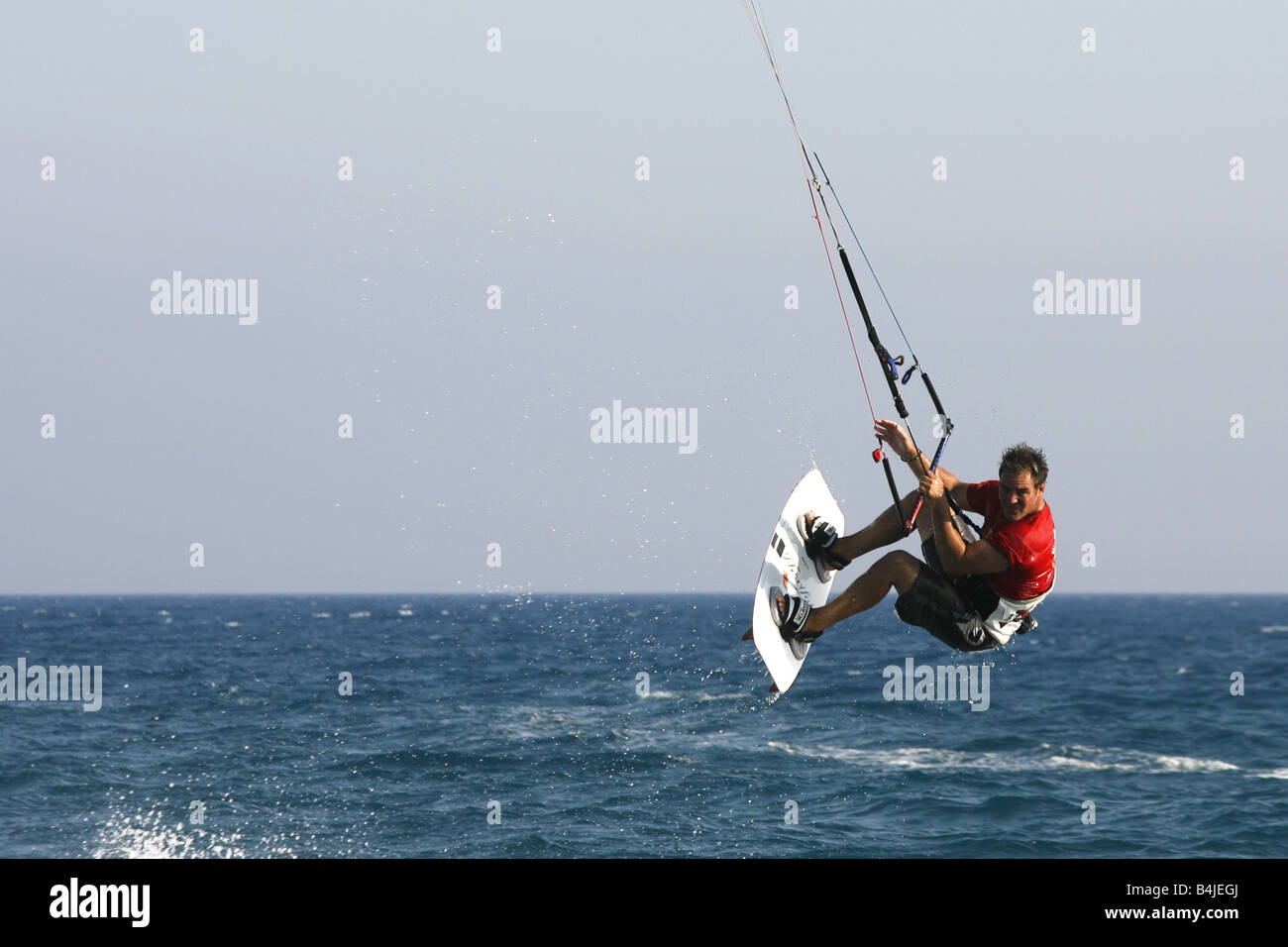 A Kite Surfing instructor demonstrates Kite Surfing in the sea off Paramali Beach near the seaside village of Pissouri in Cyprus Stock Photo
