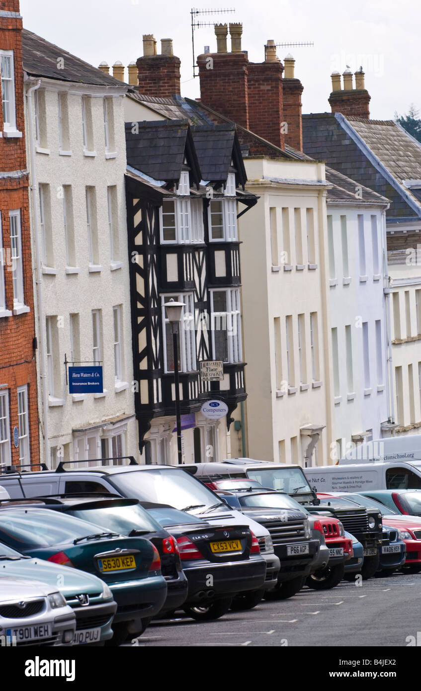 Row of houses typical of Ludlow Shropshire England UK with cars parked outside Stock Photo