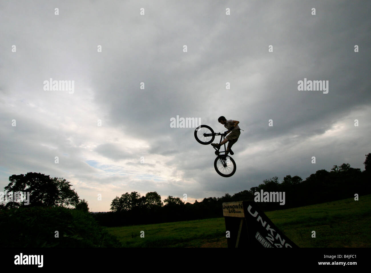 BMX biker performing tricks and jumping a large ramp Stock Photo Alamy