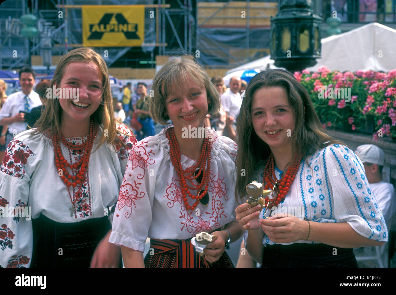 3, three, German women, German, women, adult women, eye contact, front view, portrait, smiling, Marienplatz, capital city, Munich, Bavaria, Germany Stock Photo