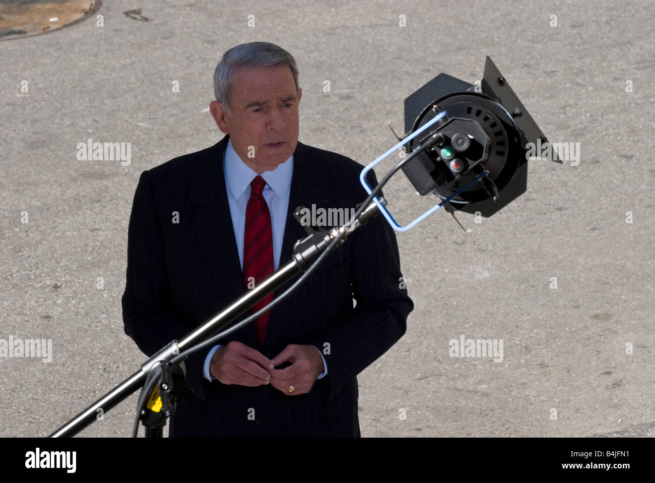 Journalist Dan Rather films a report on Wall Street in New York Stock