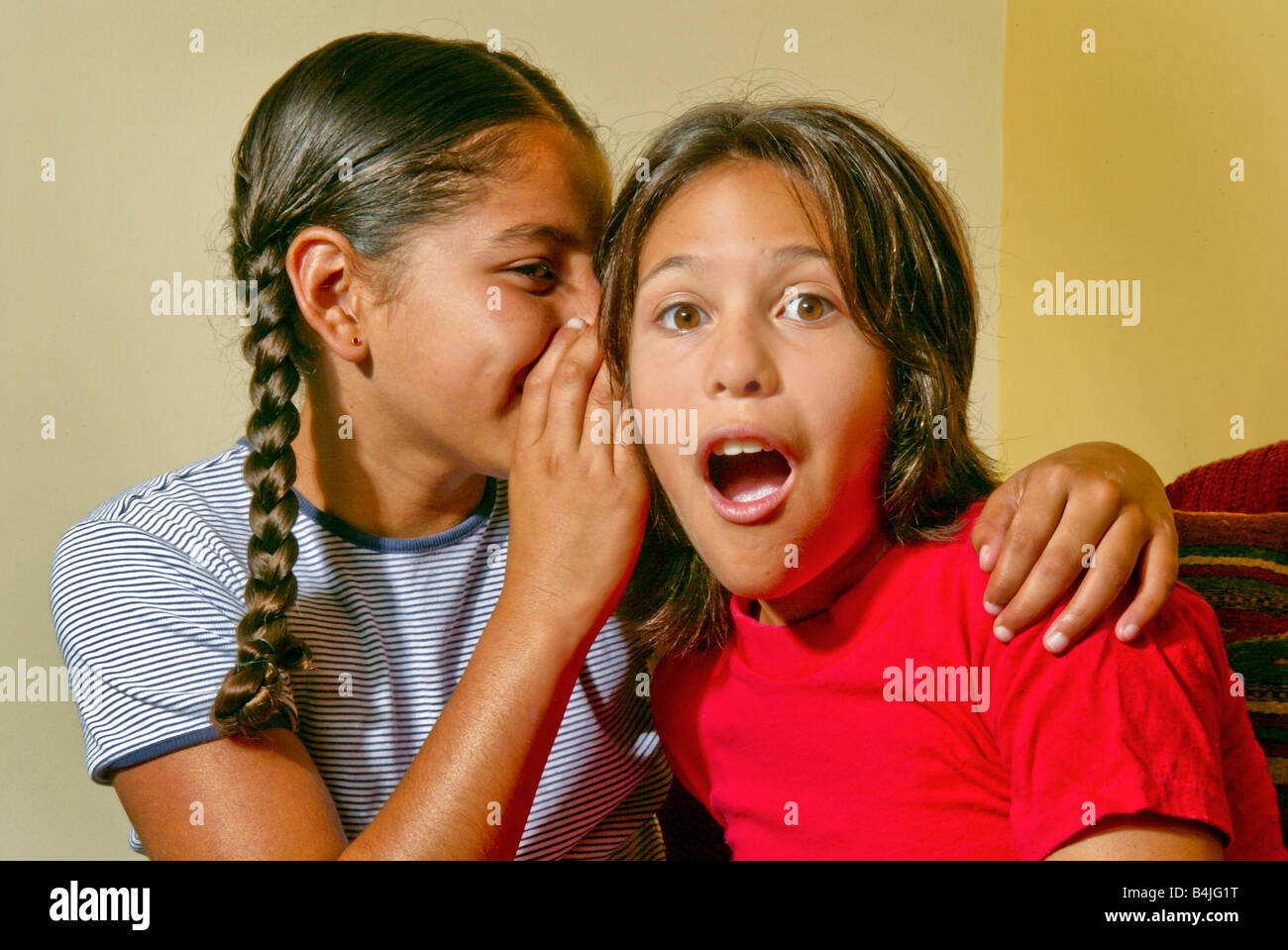Two preteen girls members of the Acjachemen tribe of Southern California share an interesting secret Stock Photo