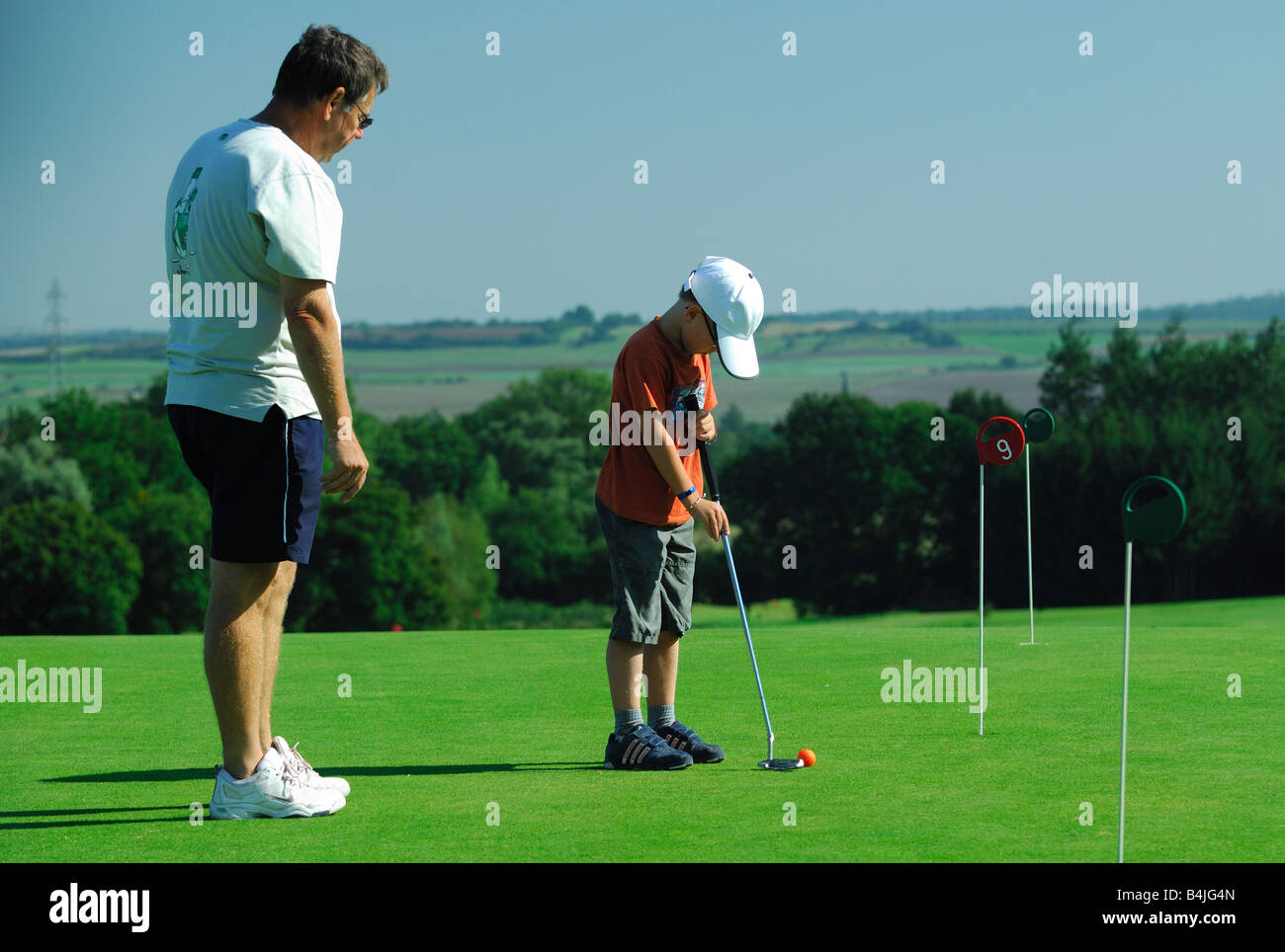 Father son playing golf hires stock photography and images Alamy