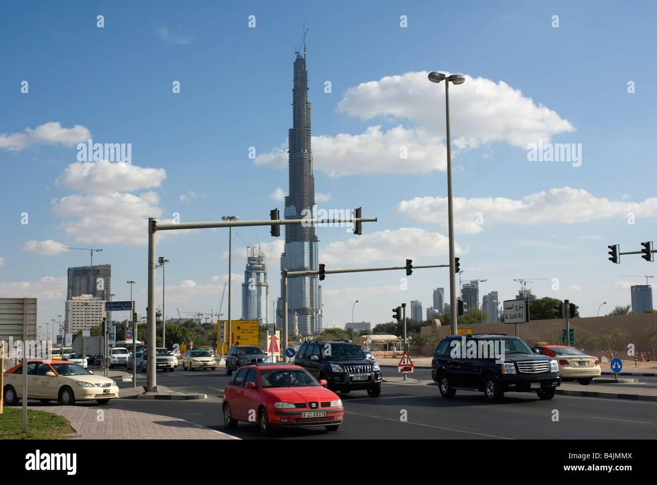 Dubai traffic Burj Dubai tallest tower in background Stock Photo
