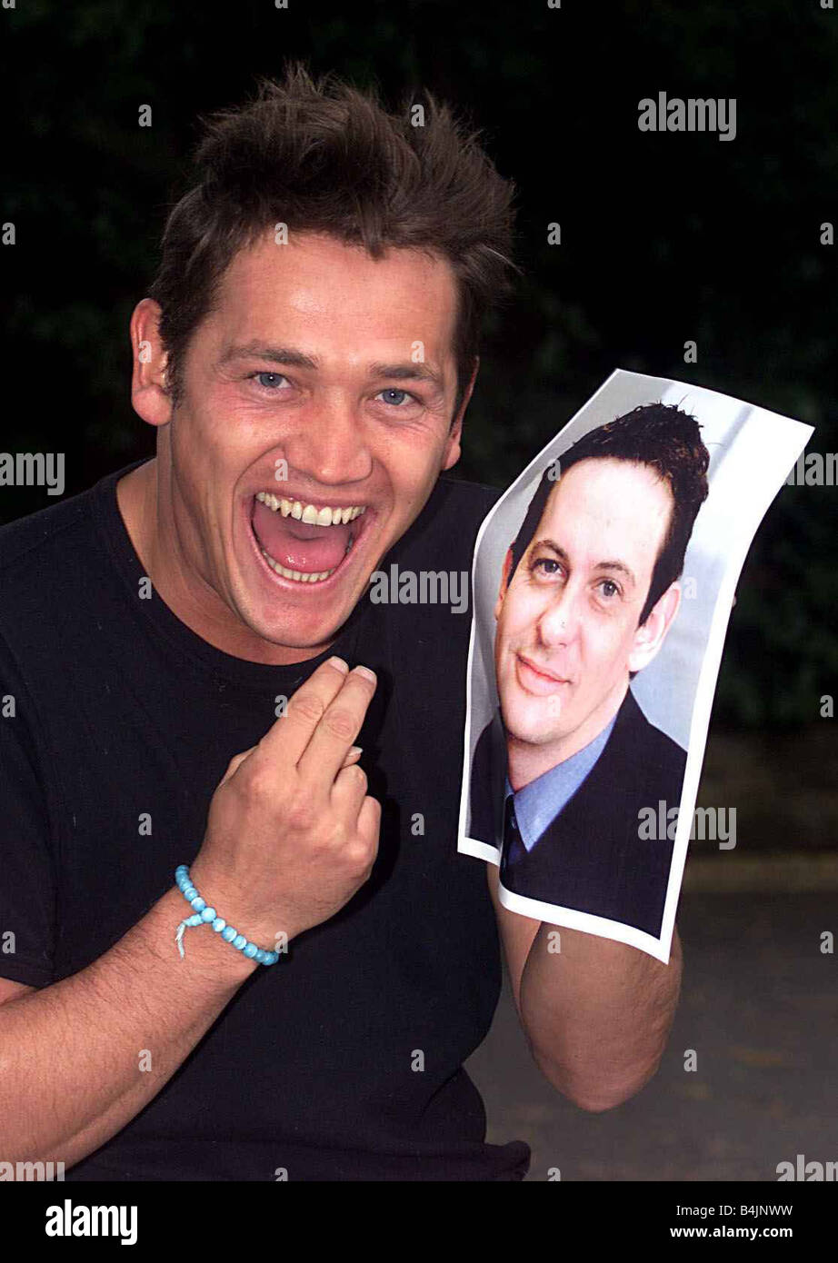 Sid Owen Actor and Ex Eastenders Star June 2000 holding a picture of ...