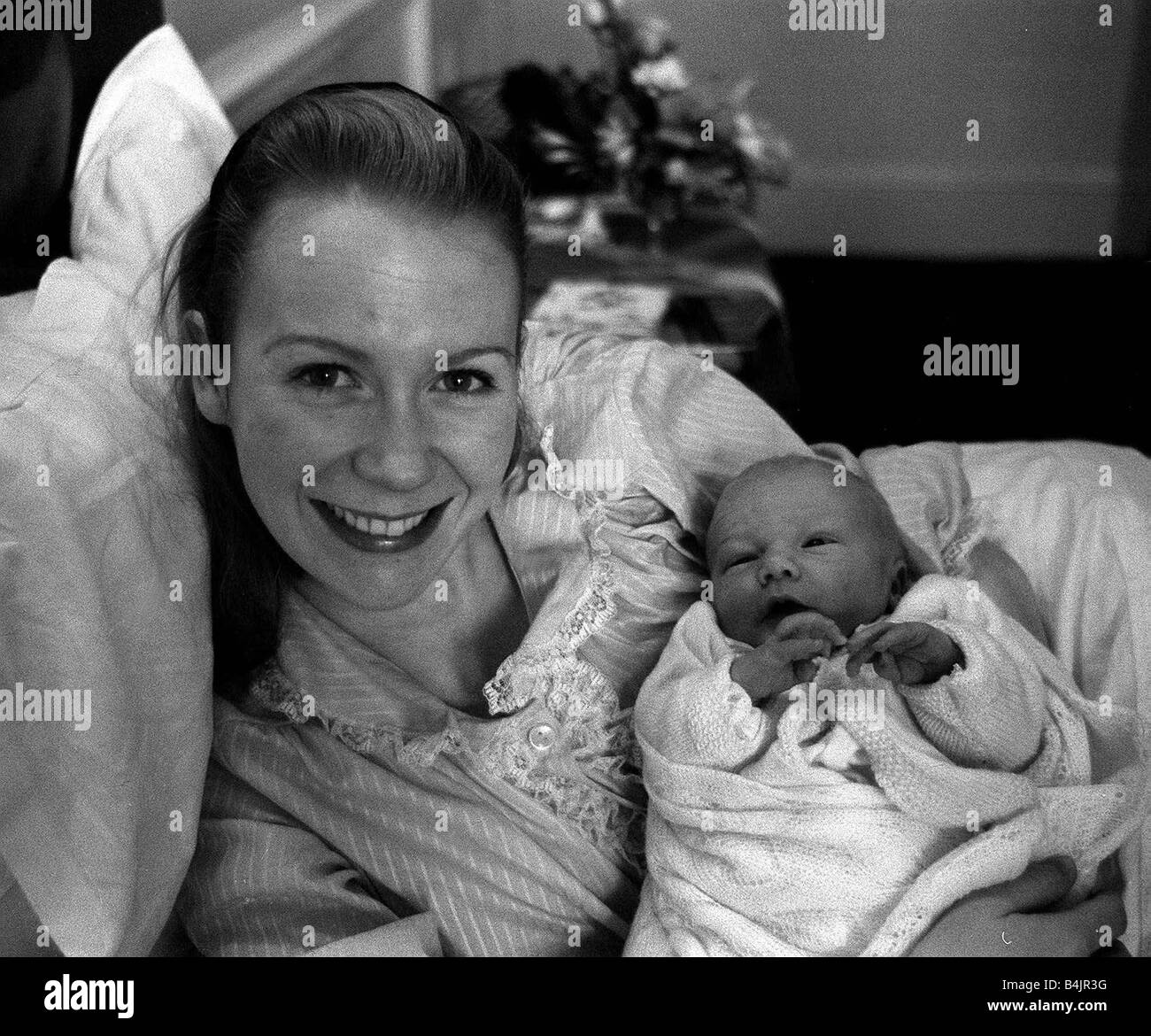 Juliet Mills pictured in hospital after the birth with her baby son Sean Ryan The picture was taken by her father John Mills who borrowed Mirror Cameraman Eric Piper s 35mm Pentax to take the picture for the family album and The Daily Mirror mdtgu Stock Photo