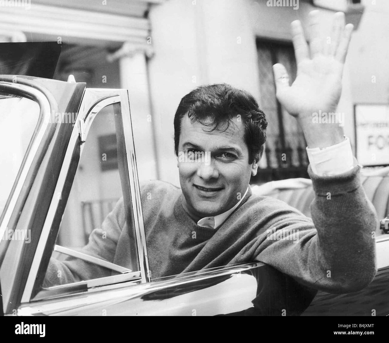 Tony Curtis, american actor poses for pictures in his Alvis TE21 motorcar in Knightsbridge, London, Thursday 2nd September 1965. Stock Photo