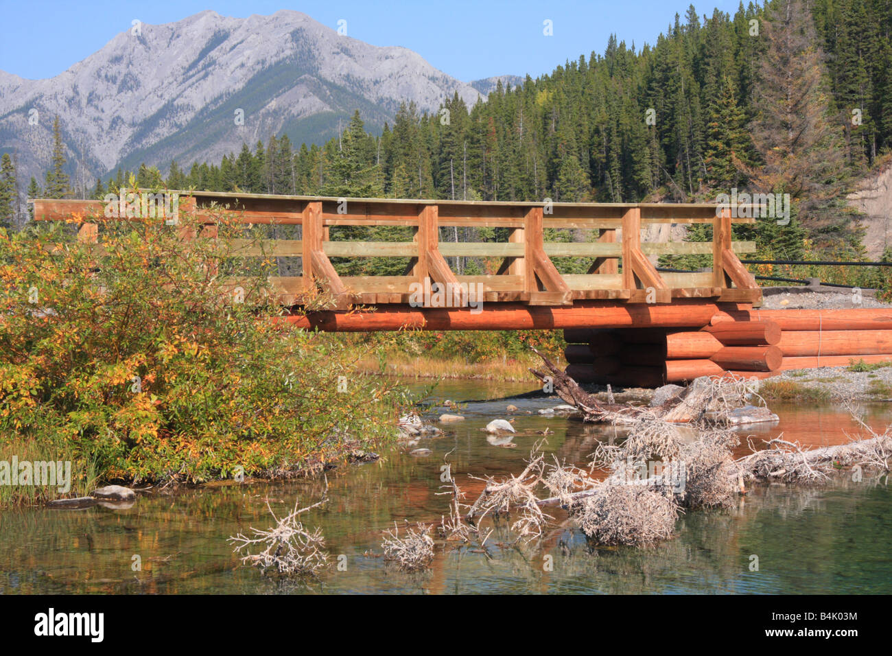 Wooden bridge above Mount Lorette pond, Kananaskis country, Alberta Stock Photo