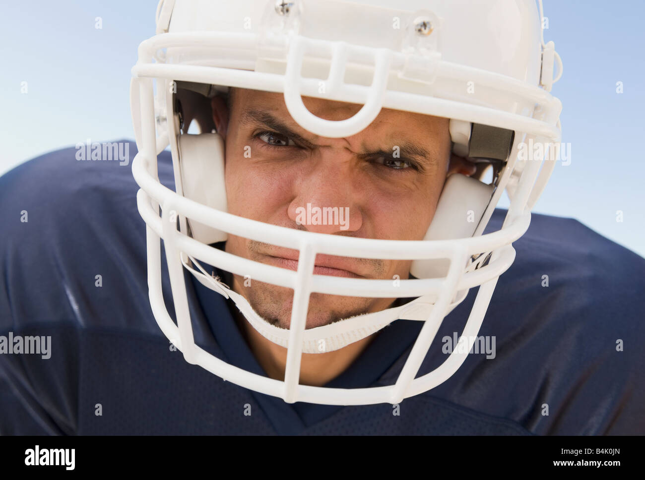 Hispanic male football player wearing helmet Stock Photo Alamy