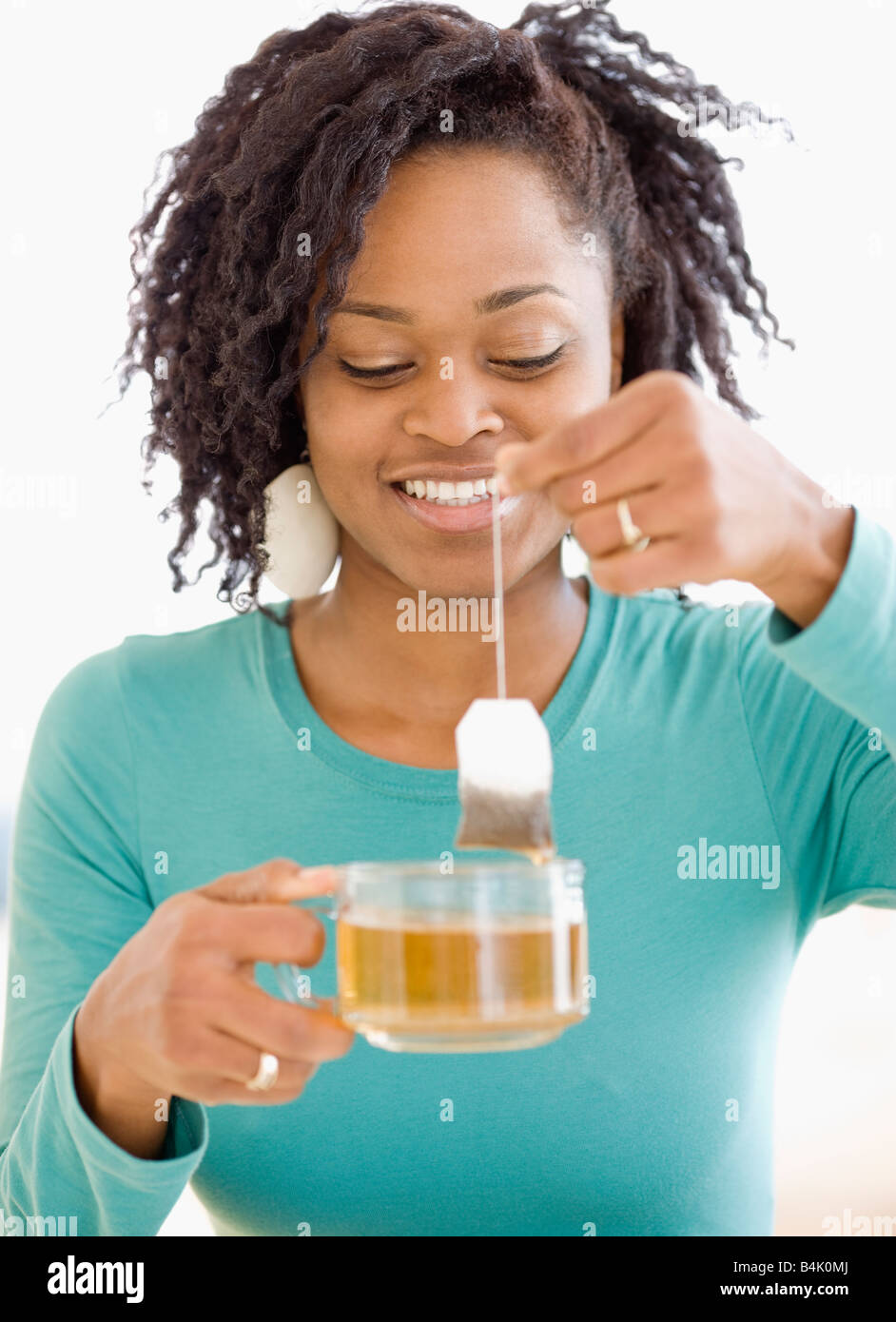 African woman holding tea bag Stock Photo Alamy