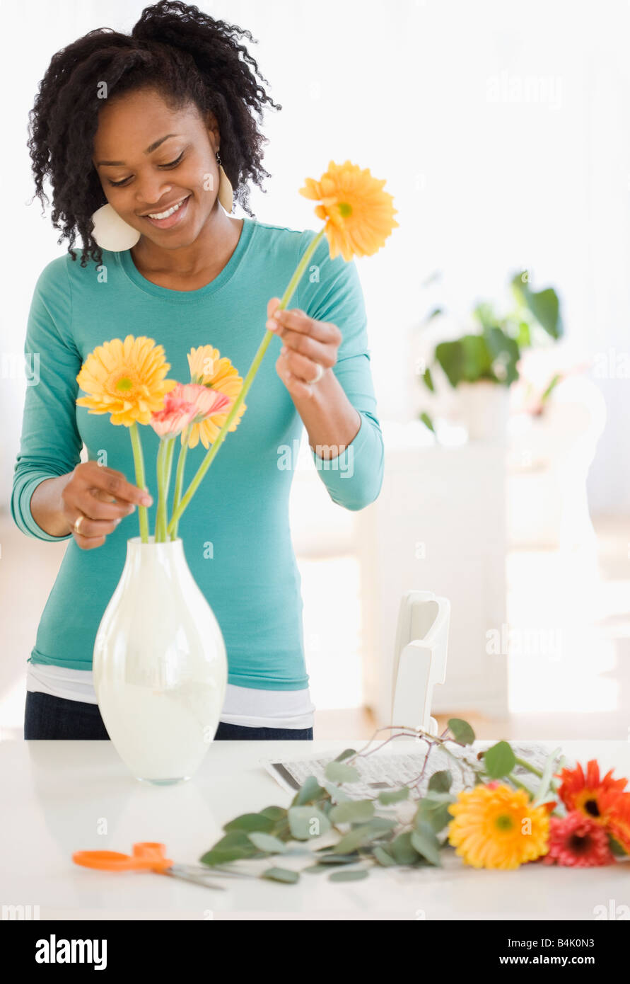 African woman arranging flowers Stock Photo - Alamy