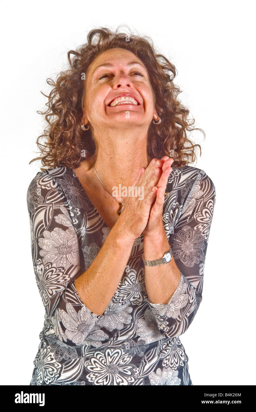 The gesture of rubbing her hands indicates anticipation in this woman