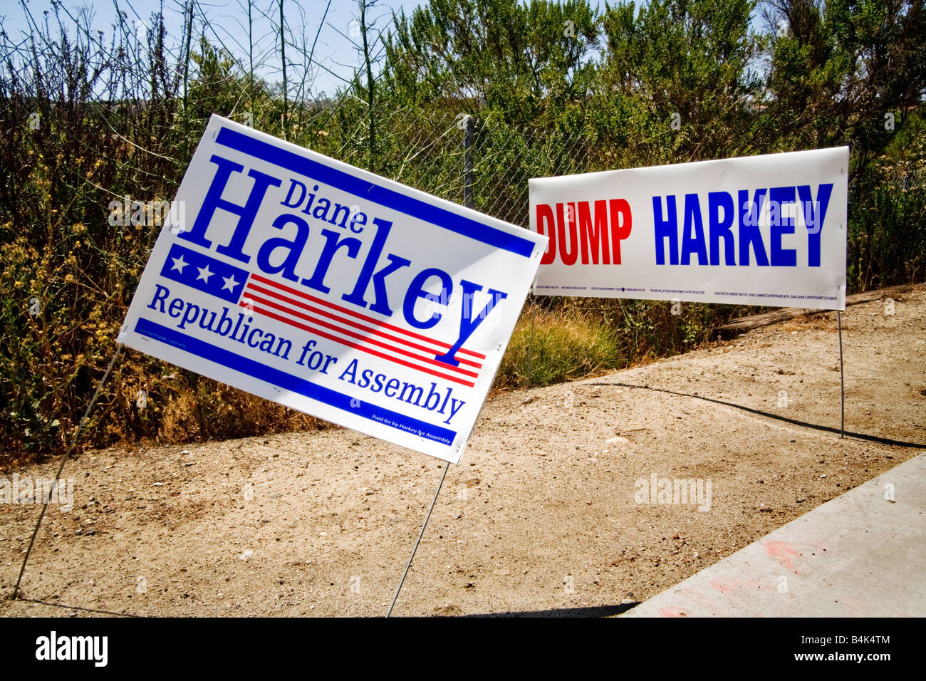 A local candidate s campaign sign in Laguna Niguel CA is ironically juxtaposed with a sign placed later that opposes her candida Stock Photo