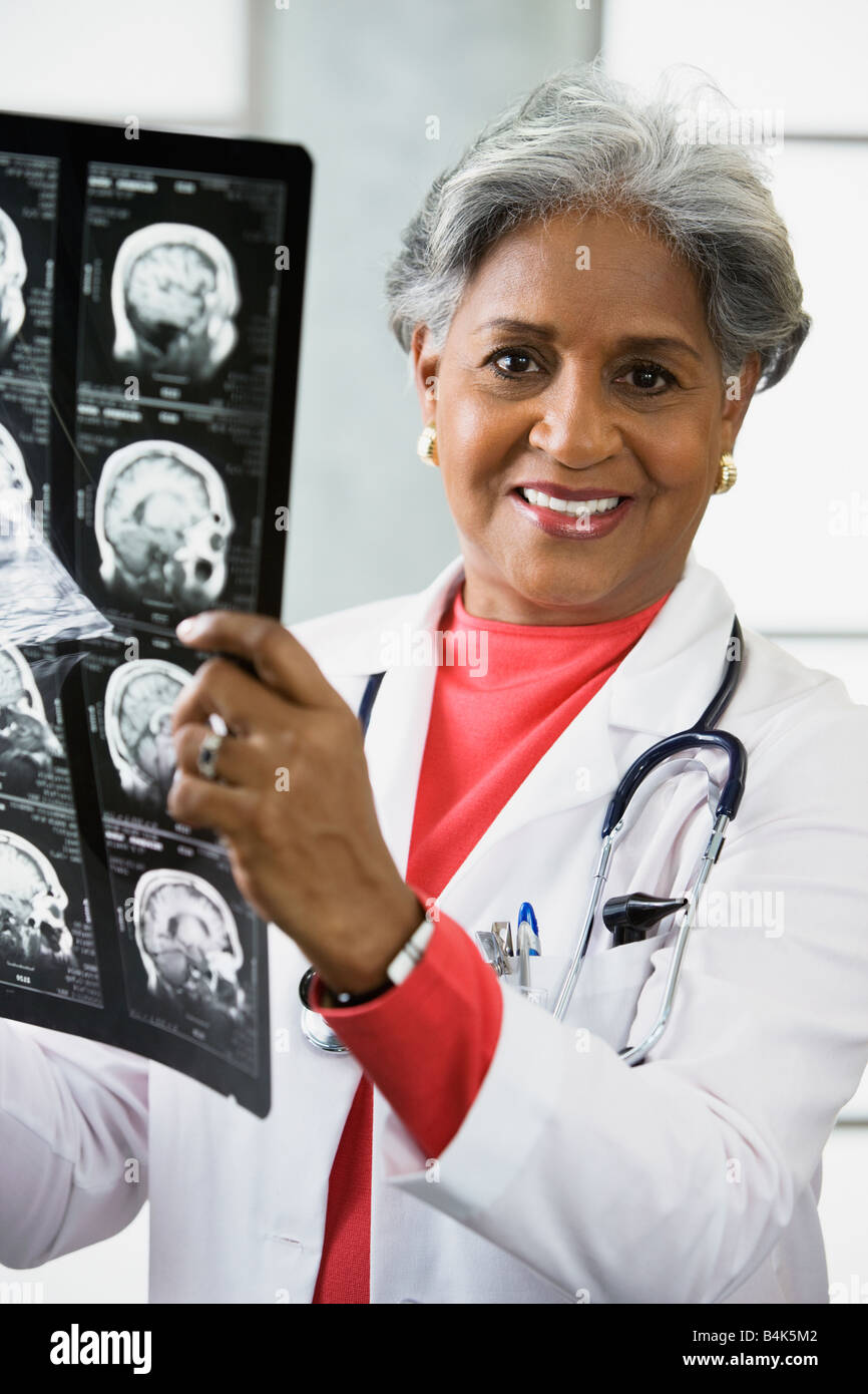 Doctor reviewing x rays hi-res stock photography and images - Alamy