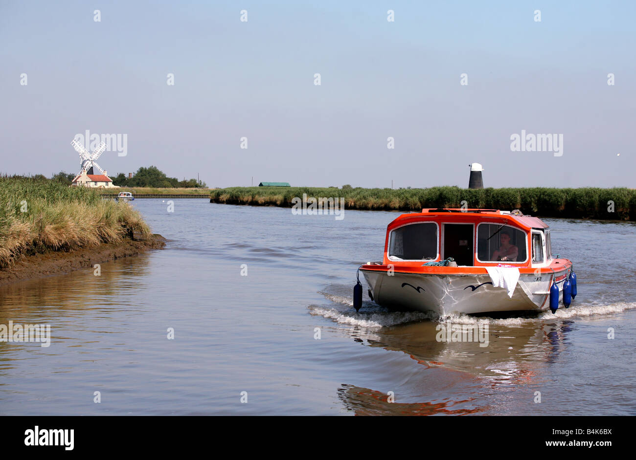 A Norfolk Broads hire boat on the River Yare with restored Burney s