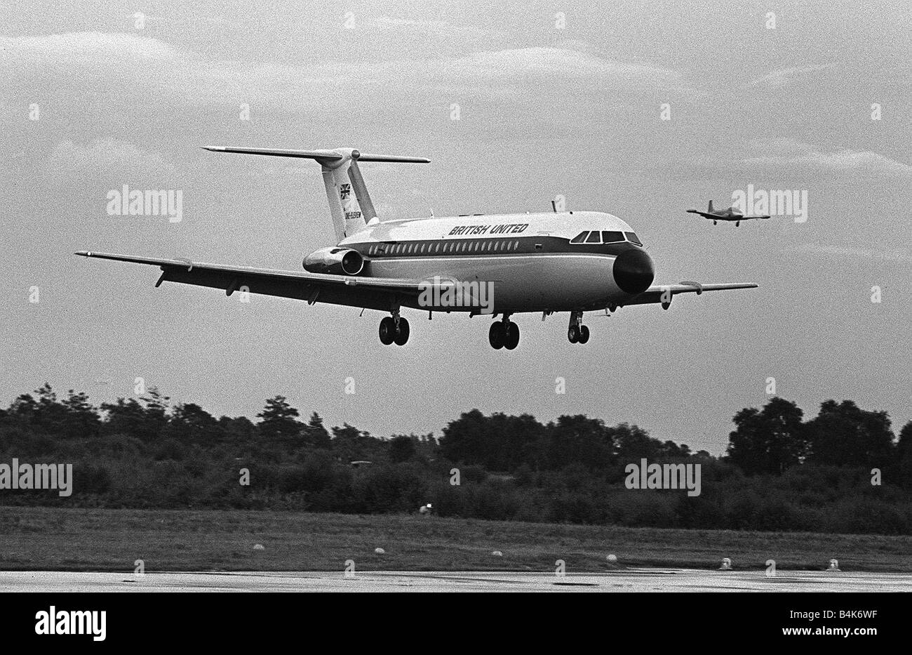 Aircraft BAC 1 11 in the colours of British United Aug 1963 BAC 1 11 in the colours of British United landing at Hurn airport followed by a Jet Provost chase plane LFEY003 Flight100 Stock Photo