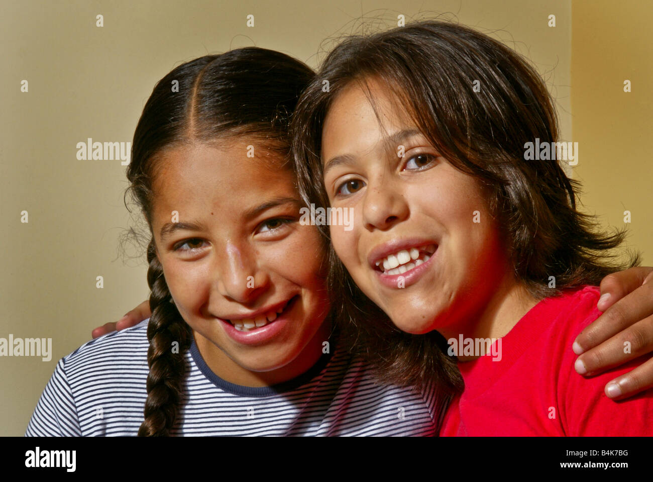 Two preteen girls members of the Acjachemen tribe of Southern California pose happily together Stock Photo