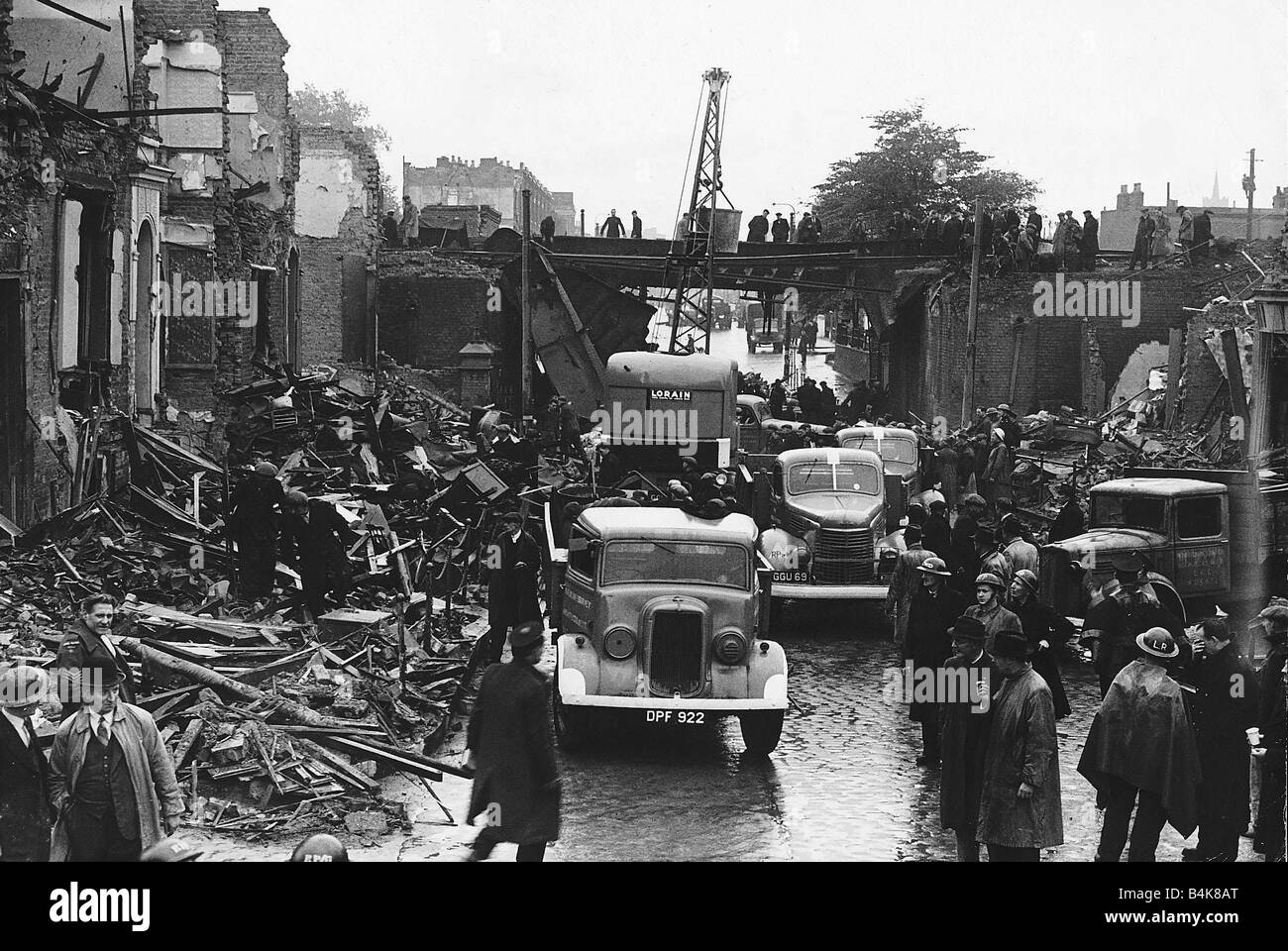 Repair work starts on a damaged bridge in Stepney London which was hit by an enemy aircraft when it crashed during WW2 1944 Stock Photo