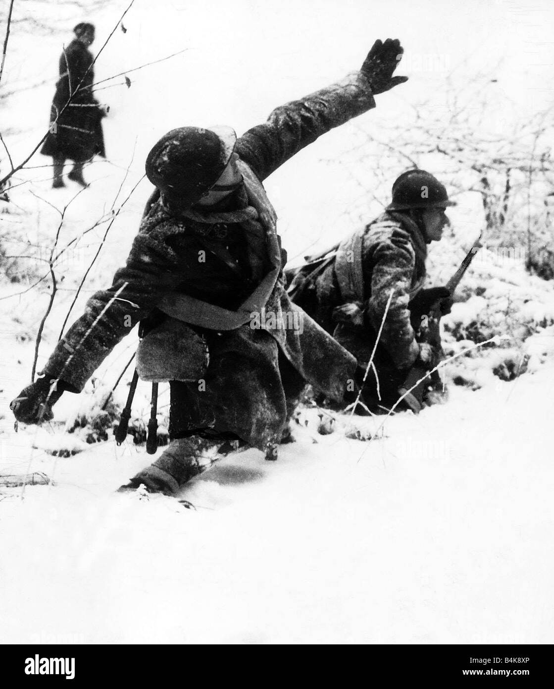 WW2 French soldier throwing a handgrenade during infantry exercise in the snow 1940 Stock Photo